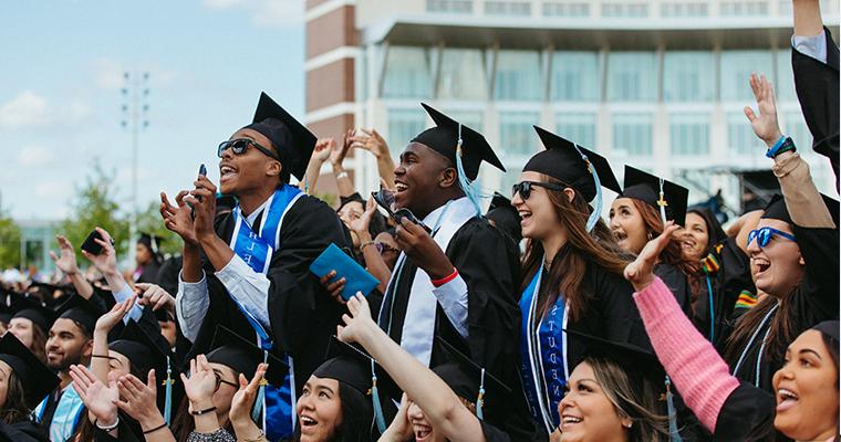 Student graduates in the commencement crowd